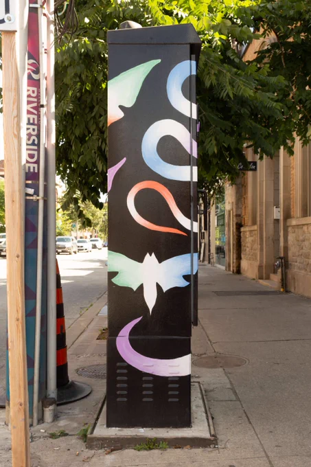 A human form reclines amongst floating visuals including dogs, a bird, moths, a milkweed pod and a snake. All forms are awash in gradients of purple, blue, green and red. The negative space around these forms is solid black.