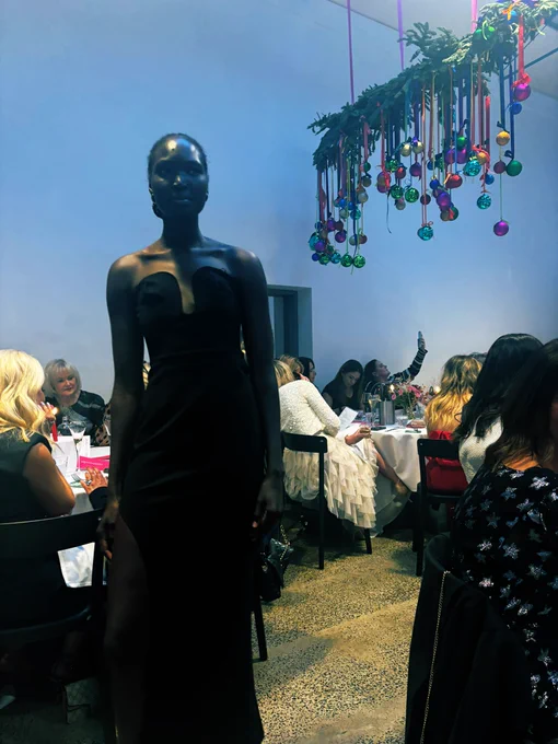 Model wearing black dress