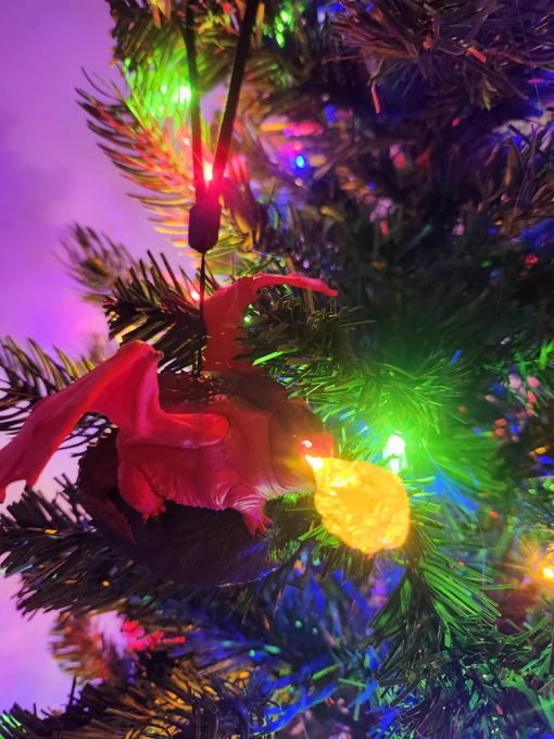 Themberchaud ornament with light up eyes and fire coming out of its mouth. 