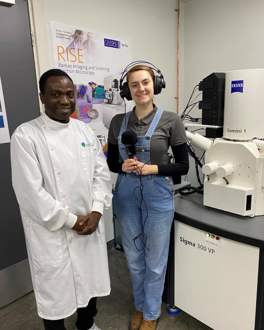 Gbotemi Adediran (left) and Alice Hope (right) standing beside equipment in the CoreMiS facility