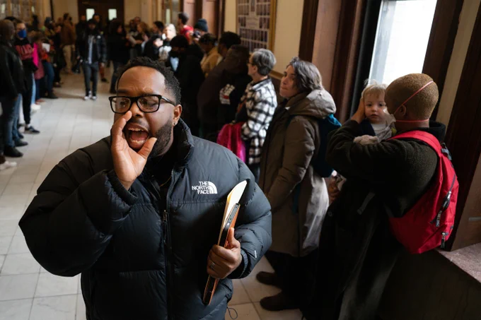 Freedom Community Center Executive Director Mike Milton chants while calling for public hearings, sponsored by the St. Louis Board of Aldermen, on the ongoing deaths at the city jail.