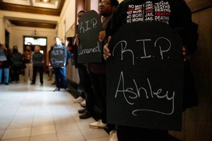 Demonstrators fill St. Louis City Hall to ask for public hearings on deaths at the city jail.