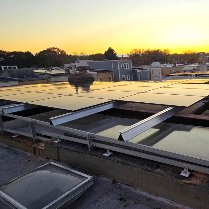 Solar panels under a Washington, DC sunset.