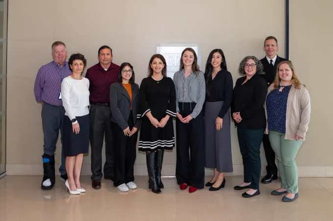 CDC Director Dr. Mandy Cohen stands with CDC staff