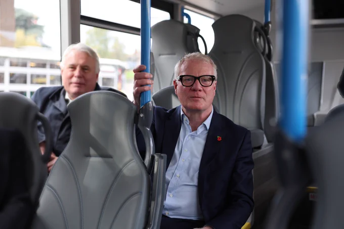 Photograph of Richard Parker sat down on a bus.
