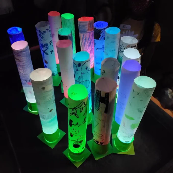 18 glowing atmosphere lanterns of many colors, created by kids during a summer program in 2021