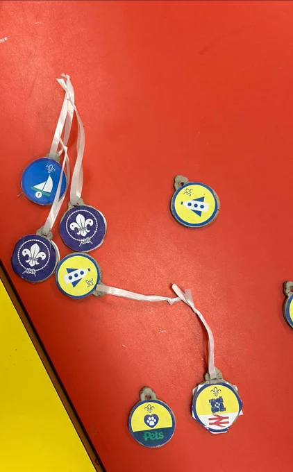 Scout badges hung on string as baubles