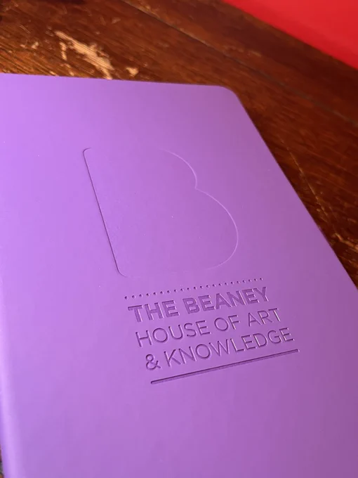a range of purple notebooks debossed with The Beaney House of Art & Knowledge logo.