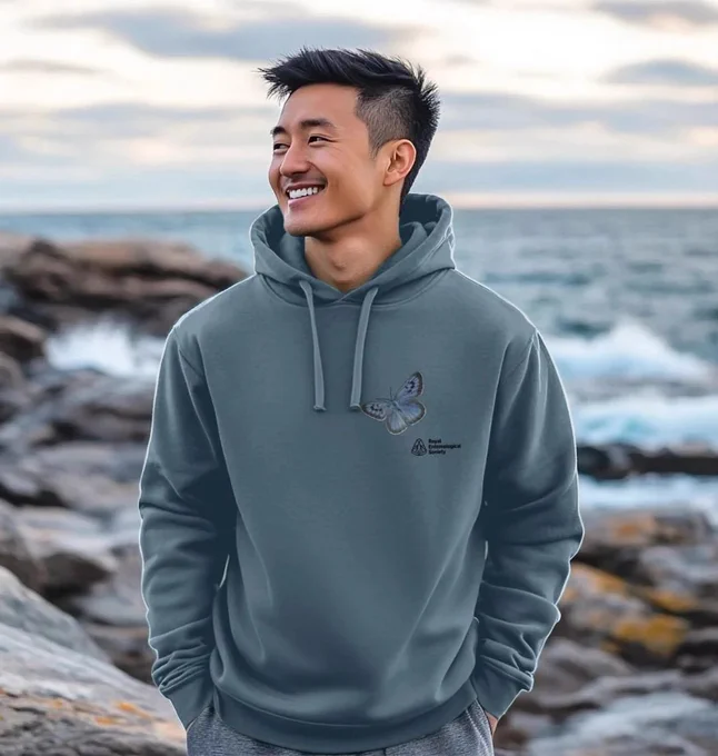 Person wearing a light blue RES Large blue butterfly hoodie