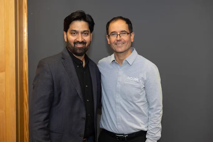 Geoff Cook and Venu Moola are standing side-by-side.