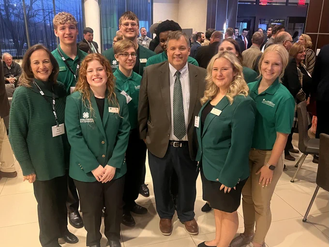 A group of 4-H ambassadors, Extension's Dean Durgan and Commissioner Thom Petersen 