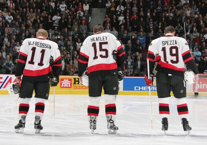 Photo of Daniel Alfredsson, Dany Heatley, and Jason Spezza lined up on the blue line prior to a game in 2005.