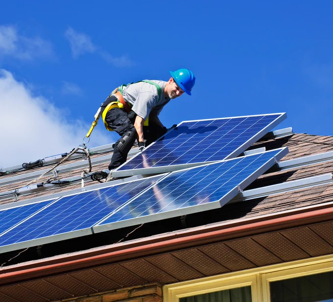 Person installing solar panels