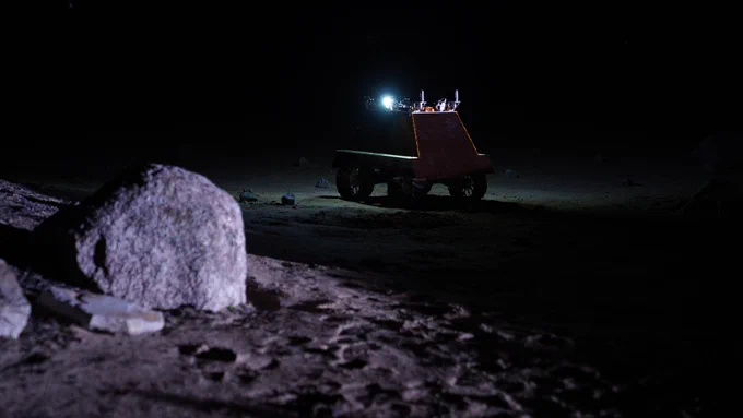 Canadian lunar rover prototype exploring a Moon-like surface.