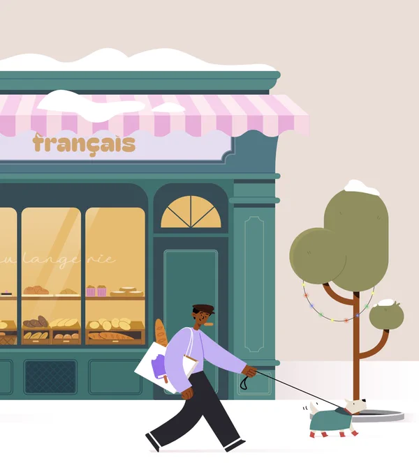 Screenshot of the French store front of Study Snacks. You can see snow on the roof of the store, lights hanging in the tree. The dog on the leash is wearing boots and a cute coat.