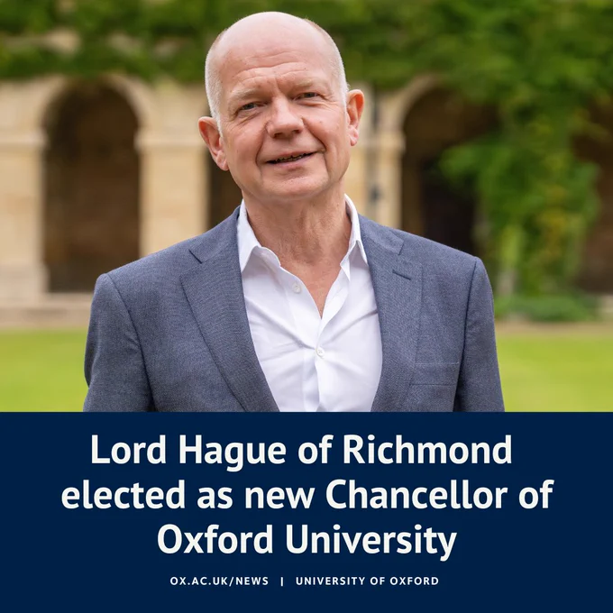 Portrait of Lord Hague of Richmond, smiling in front of a building at Magdalen College, with the headline: Lord Hague of Richmond elected as new Chancellor of Oxford University  