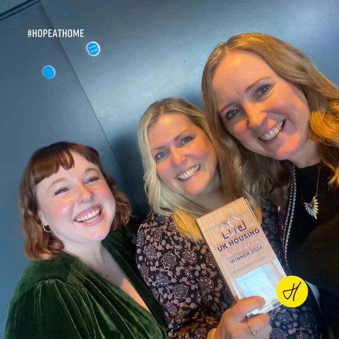 L-R Bethan Bishop, Sharon Wood, and Lucy Parish of Hopestead with the Homelessness Project of the Year award at the UK Housing Awards on 26 November 2024