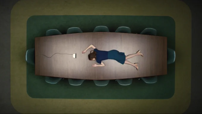 From Severance. An overhead view reveals Britt Lower as Helly laying splayed on top of a brown conference table with multiple chairs around. A small, white speaker is placed in front of her. At the top of the image is the Apple TV  logo with the words, “Let’s table this.”