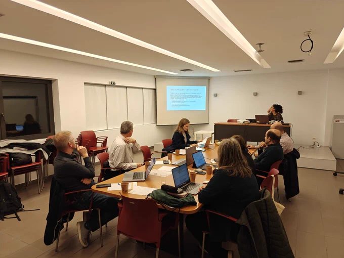 The Immerse team working around a table during the kick-off meeting.