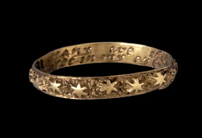 Gold posy ring with inscription to the inner face and maker's mark. Ornamented on outside of the hoop with 16 stars in relief. British Museum, 17thC-18thC.
