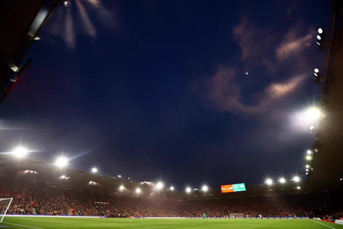A general view of St Mary's Stadium during a night time game, with the floodlights around the top of each stand on and illuminating the pitch below.