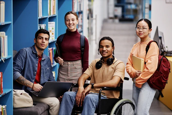 A diverse group of students in a library 