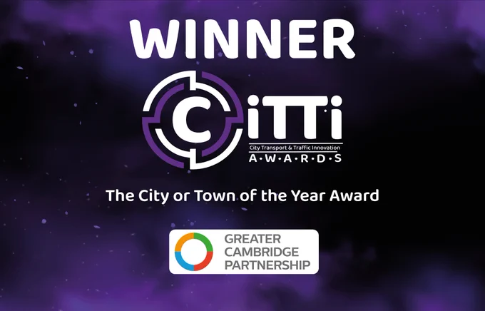 Graphic reading 'WINNER CiTTi AWARDS. The City or Town of the Year Award. Greater Cambridge Partnership' on a black and purple background.