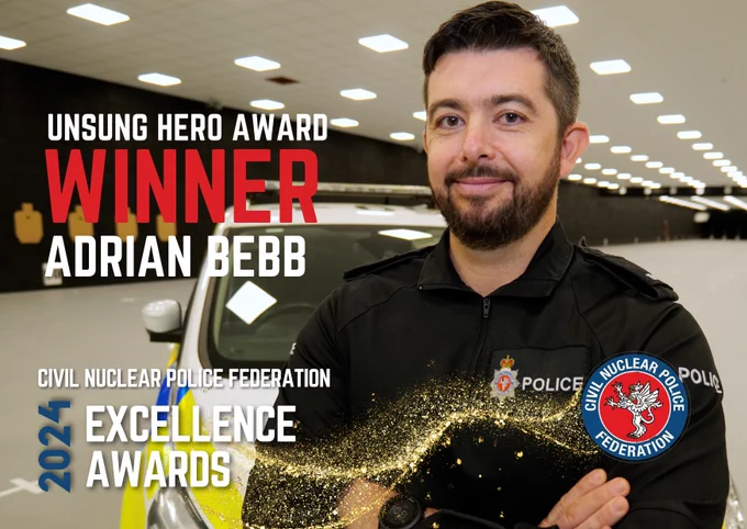 Adrian Bebb, wearing his police uniform, stands in front of a police car with his arms folded. The image is overlaid with text that reads, Unsung Hero Award Winner Adrian Bebb, alongside the CNP Federation Logo.