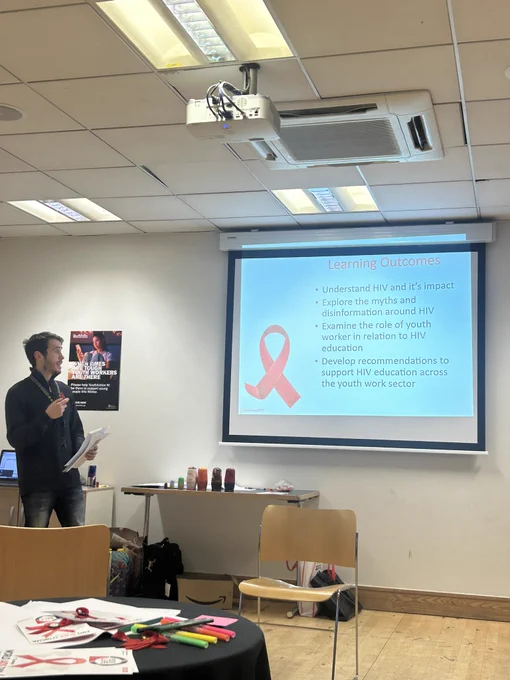 An image of one of our youth workers presenting to the room.