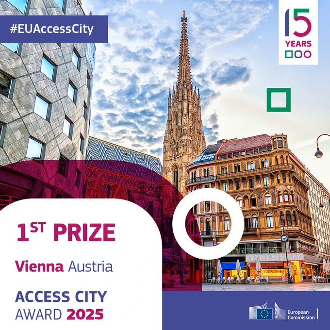 A view of Vienna, Austria, highlighting St. Stephen's Cathedral with its towering spire alongside modern and historic buildings under a dramatic sky. The text celebrates Vienna as the 1st prize winner of the Access City Award 2025, commemorating the 15th anniversary of the award. 