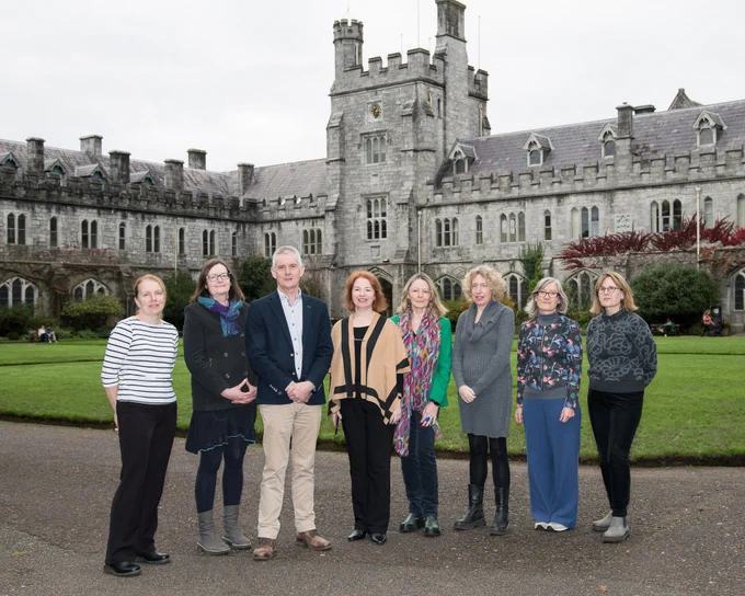 From left to right Dr Olive McCarthy, Dr Noreen Byrne, Dr Seamus O’Reilly, Dr Carol Power, Prof Maggie O'Neill, Dr Claire Edwards, Dr Bridget O'Carroll, Dr Carol Kelleher standing in front of the quad at University College Cork.