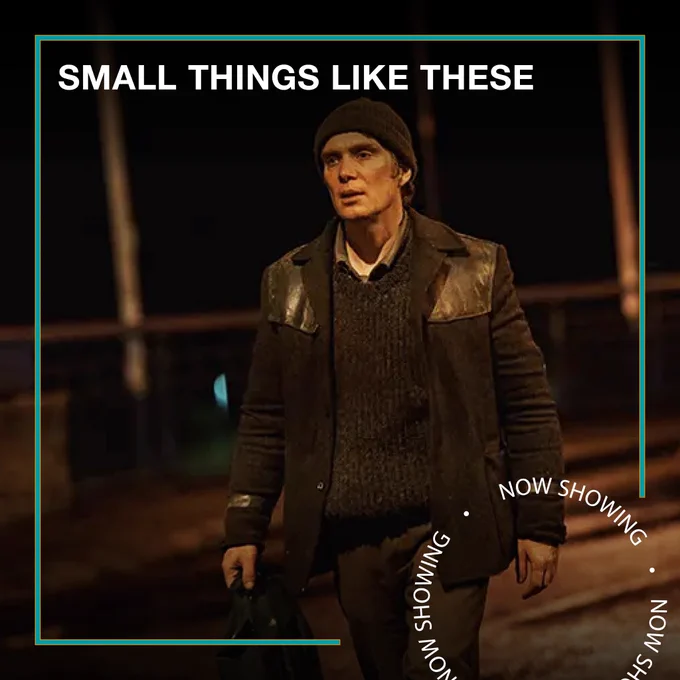 Cillian Murphy wears a beanie hat and a leather jacket and walks outside the dark. Text - Small Things Like These, Now Showing