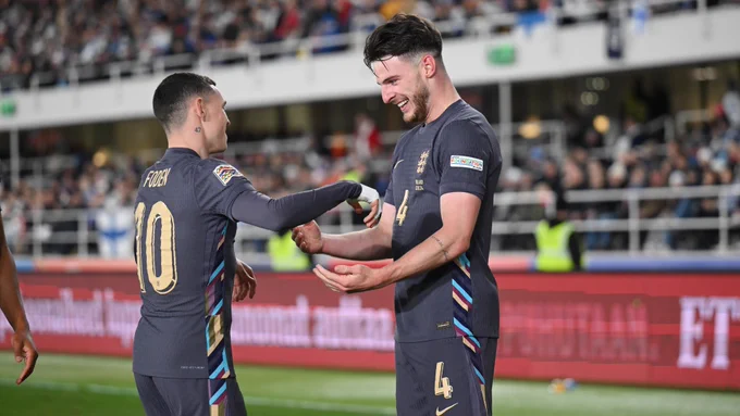Phil Foden and Declan Rice celebrate.
