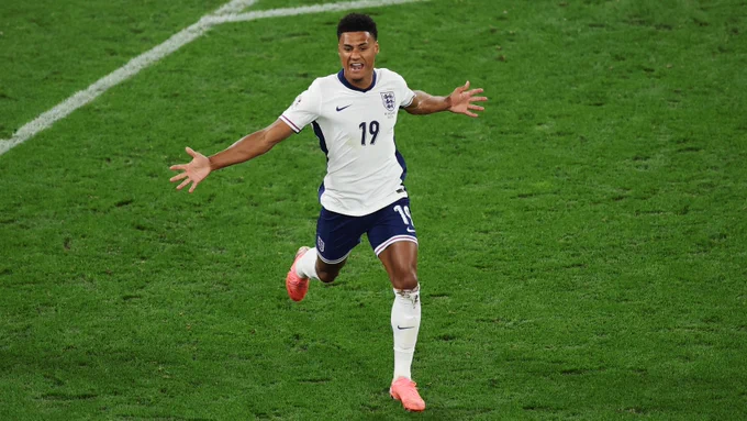 Ollie Watkins celebrates scoring.