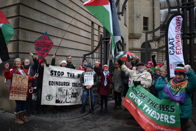 A crowd of Palestine solidarity demonstrators outside Edinburgh Sheriff Court.