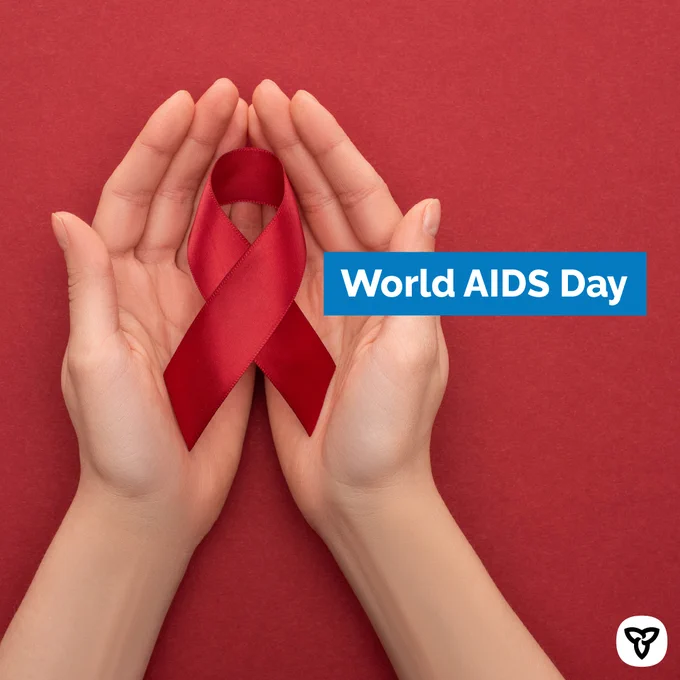 Hands holding red ribbon. Image Text: World AIDS Day.
