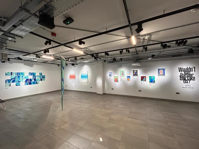 Wide angled photograph of the ‘Wouldn’t you rather talk like us?’ art exhibition at City Lit gallery showcasing the groundbreaking work of Paul Aston & Conor Foran