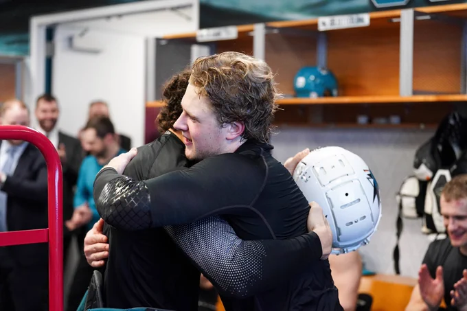 Mario Ferraro hugs Ethan Cardwell. 