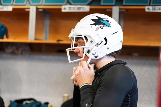 Ethan Cardwell puts the helmet on. 