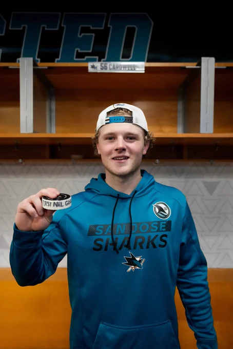 Ethan Cardwell poses with his first goal puck.