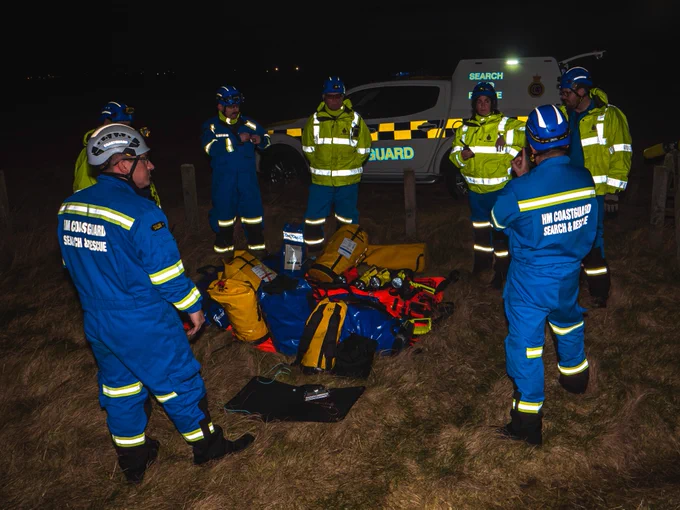 A Coastguard Rescue Team during a training exercise at night