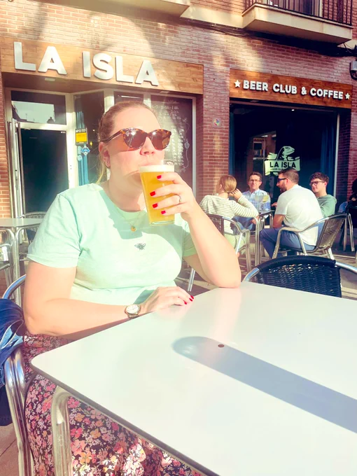 Sophie sat drinking a beer in the sun outside La Isla Beer Club Murcia.
