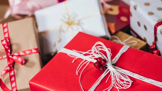 #Accessibilty: A stack or wrapped presents scattered about and piled on top of each other