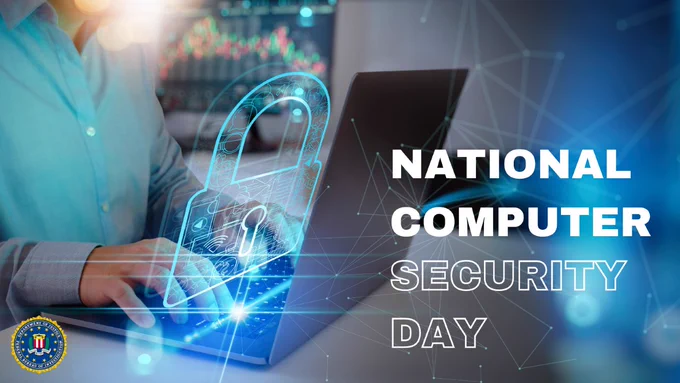 A faceless person is sitting at a computer with the screen on bright with a blue hue glowing from he screen in the shape of a lock.  National Computer Security Day on the right with the FBI seal in the bottom left