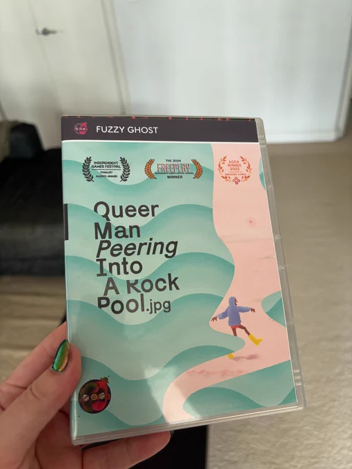 A DVD case of the game "Queer Man Peering". 