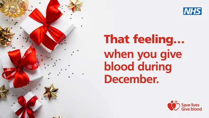 Graphic shows presents wrapped with red ribbon, surrounded by gold confetti and decorations. Red text on screen reads: That feeling... when you give blood during December.