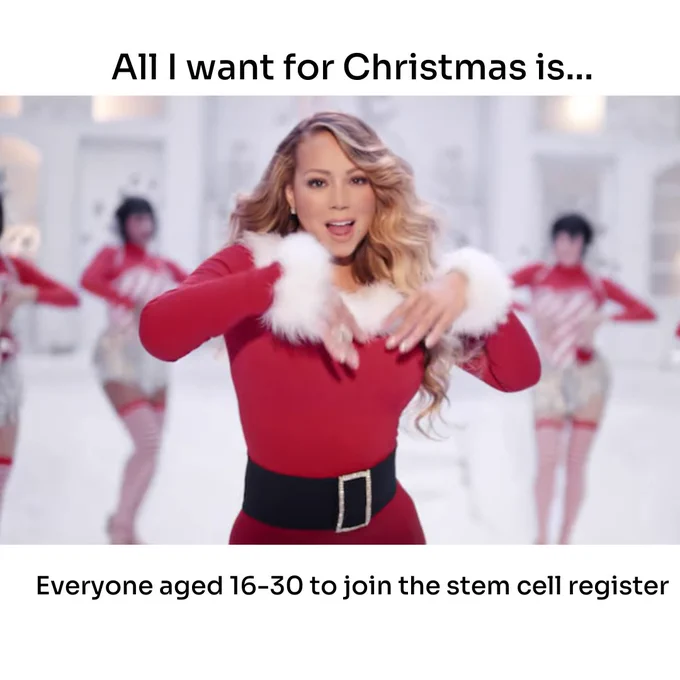 Mariah Carey in a festive red outfit with white fur accents, flanked by dancers in similar costumes, encouraging people aged 16-30 to join the stem cell register, set against the phrase "All I want for Christmas is...