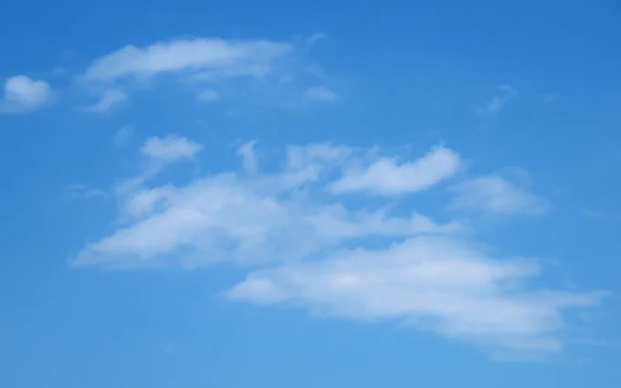 Wikimedia Commons photo of an actual blue sky. With some clouds in it, to make it abundantly clear that it's a sky and not just a blue rectangle.