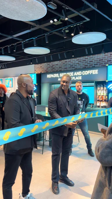 Emile Heskey cuts the ribbon to make it official