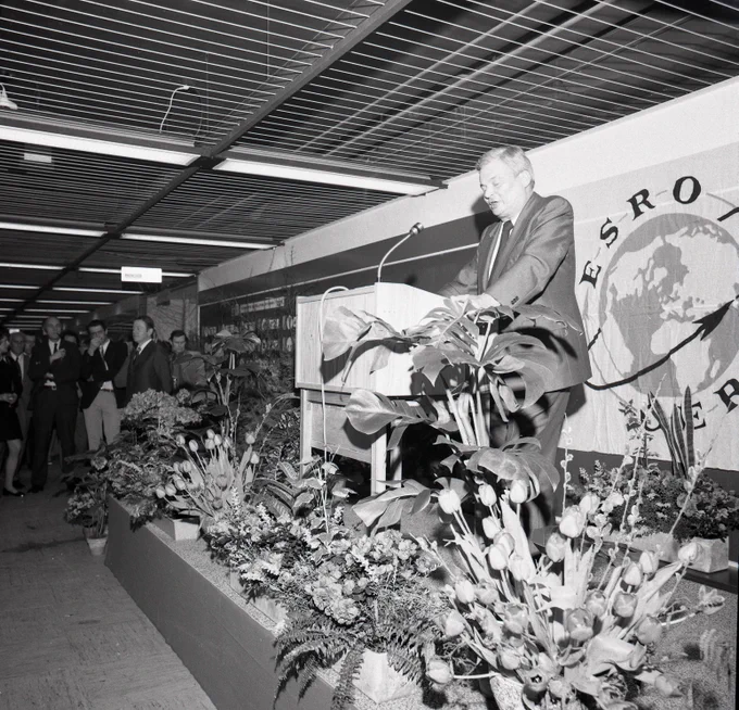 March 1974 – Alexander Hocker speaking at the '10 Years of ESRO' anniversary party in the main corridor at ESTEC in the Netherlands.